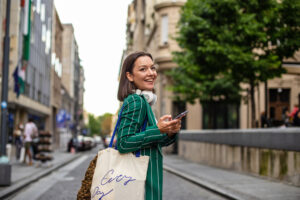 Businesswoman on the street wearing green jacket